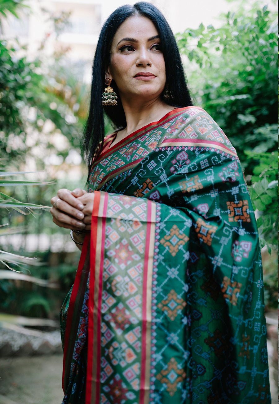 Anu Mishra in Jungle Green Rangeen Patola Contrast Woven Silk Saree